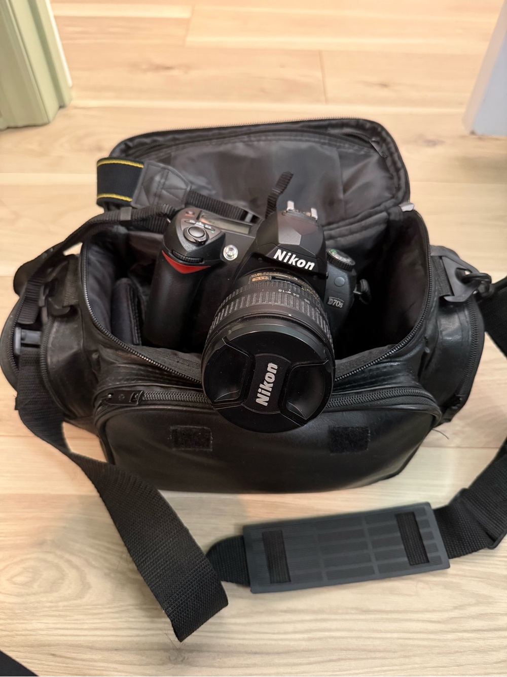 Nikon DSLR Camera in Black with Attached Lens